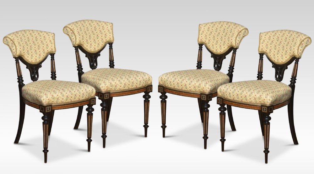 Set of four ebony and amboyna side chairs