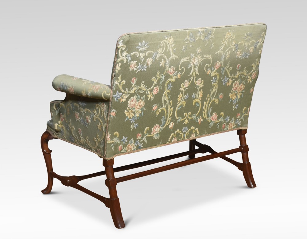 A two-seat Queen Anne style settee upholstered in green floral damask fabric with polished walnut cabriole legs and stretchers. View III
