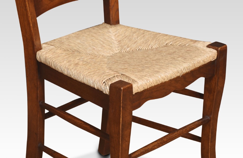 Set of eight oak ladder back dining chairs View V