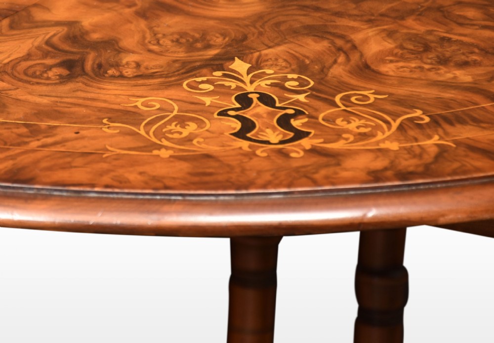 Victorian burr walnut Sutherland table with floral marquetry inlay, turned spindle legs, and drop-down leaves. View VI