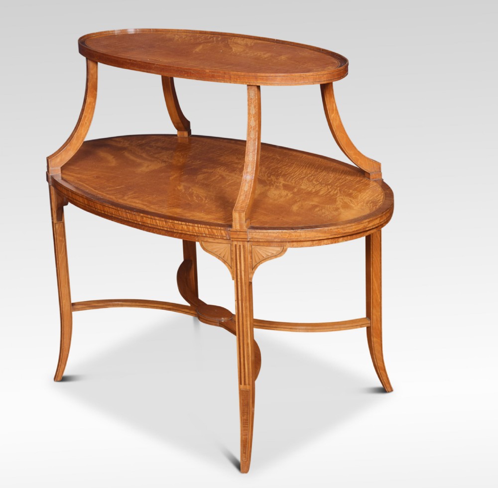 A two-tiered oval satinwood and mahogany etagere table featuring marquetry stringing, curved leg supports, and twin brass carrying handles. View III