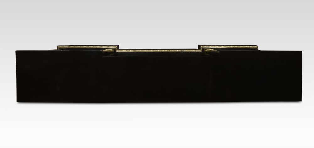 A large, low ebonised black wooden open bookcase featuring three sections outlined with decorative gilt brass mounts. View IX