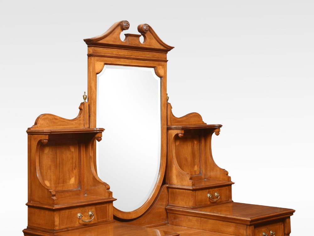 An Edwardian mahogany inlaid dressing table featuring a central oval mirror, upper trinket drawers, and twin pedestals with brass handles. View VIII
