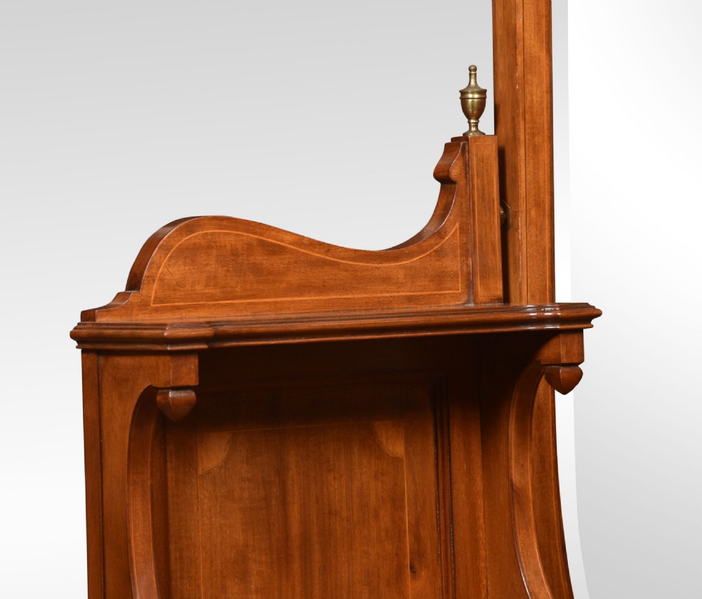 An Edwardian mahogany inlaid dressing table featuring a central oval mirror, upper trinket drawers, and twin pedestals with brass handles. View XI