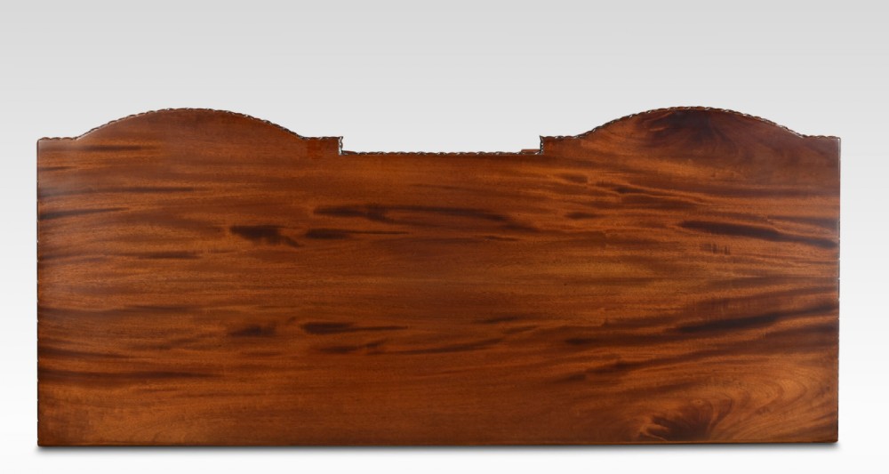A deep brown mahogany inverted breakfront sideboard featuring carved accents, flame mahogany door panels, two central drawers, and carved claw-and-ball feet. View IX