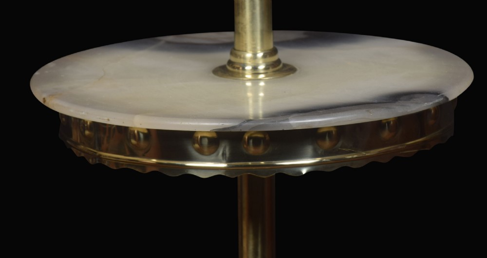 An antique brass adjustable standard lamp with an integrated circular marble tray shelf and a scrolled tripod base. View III