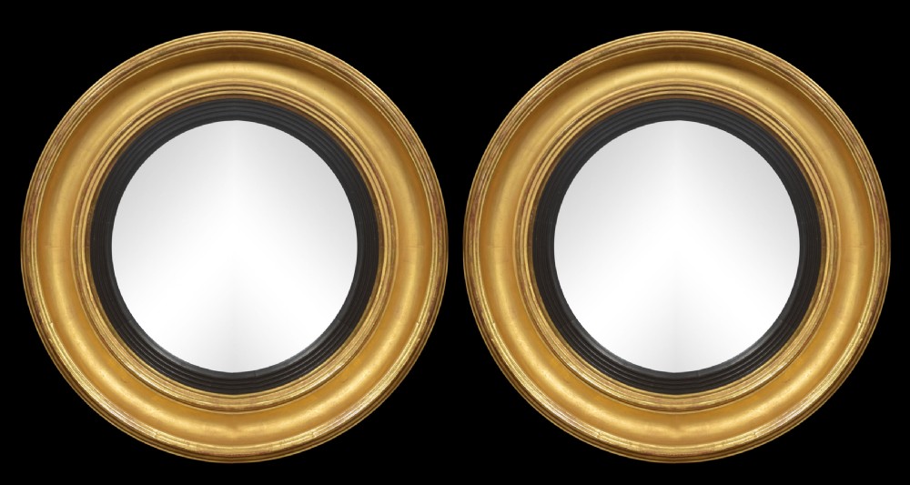 Pair of Regency style gitwood convexed wall mirrors