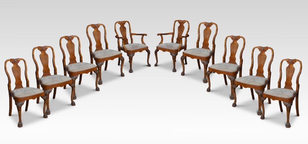 Set of ten walnut George II style dining chairs
