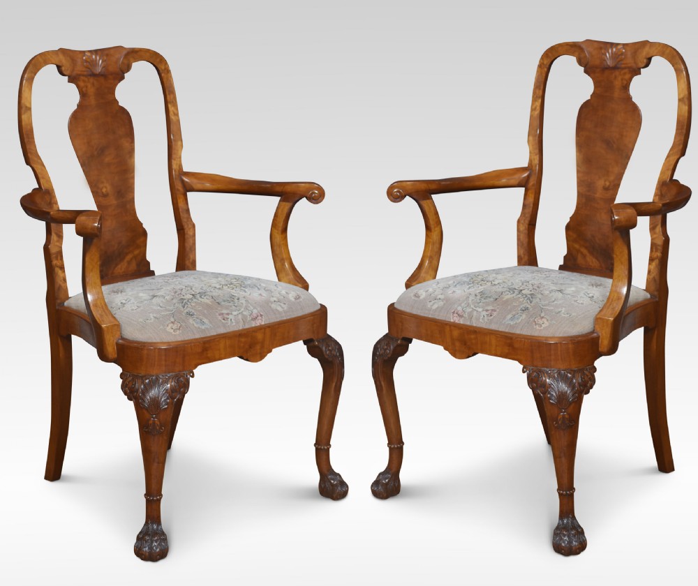 Set of ten walnut George II style dining chairs View II