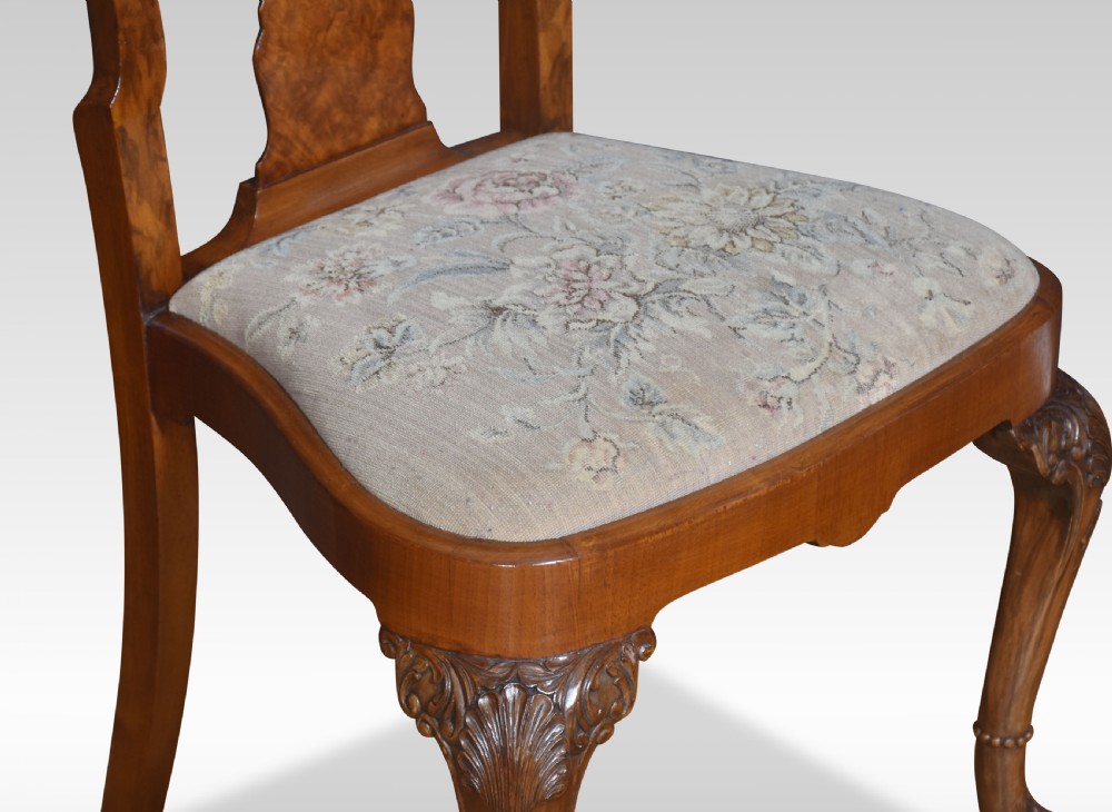 Set of ten walnut George II style dining chairs View X