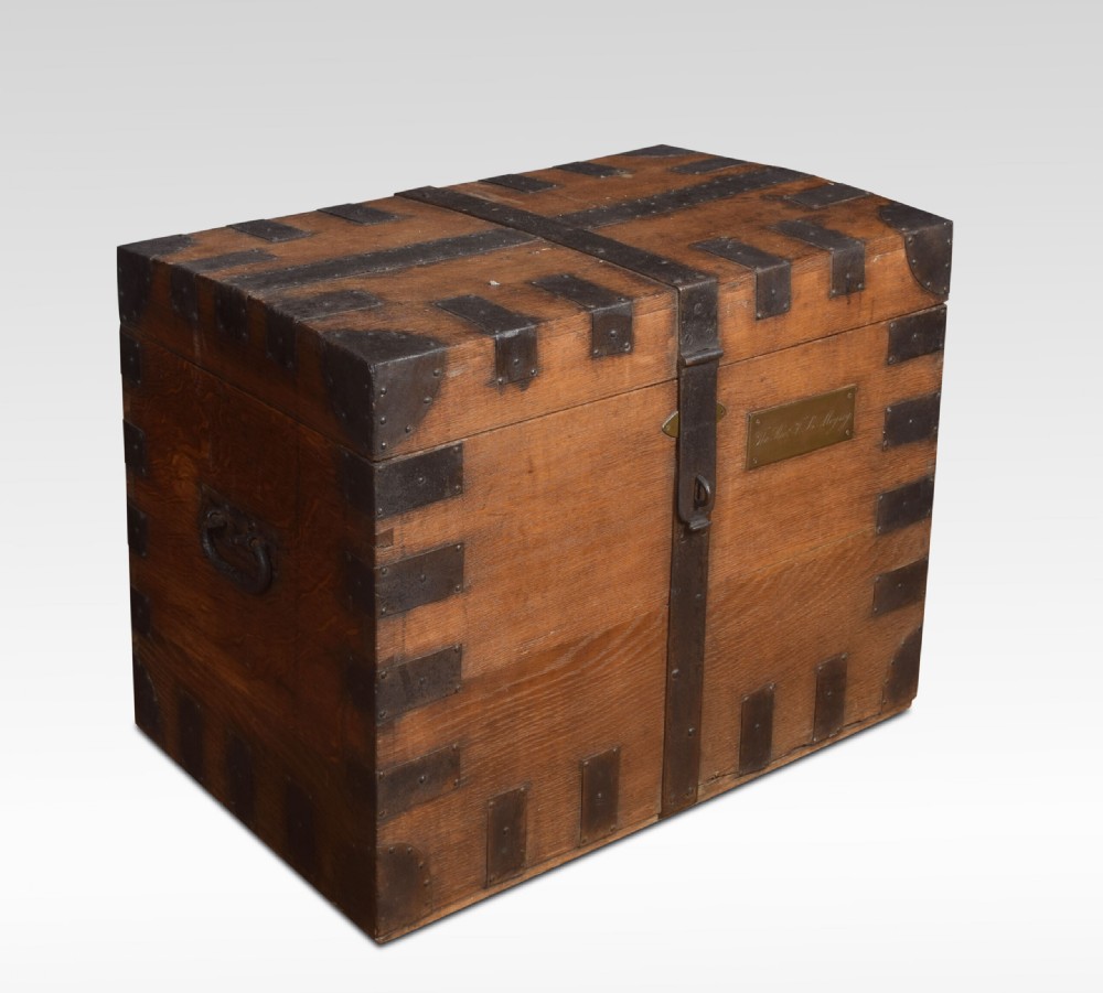 A 19th-century solid oak silver chest reinforced with dark iron straps, corner brackets, and a central latch. View II