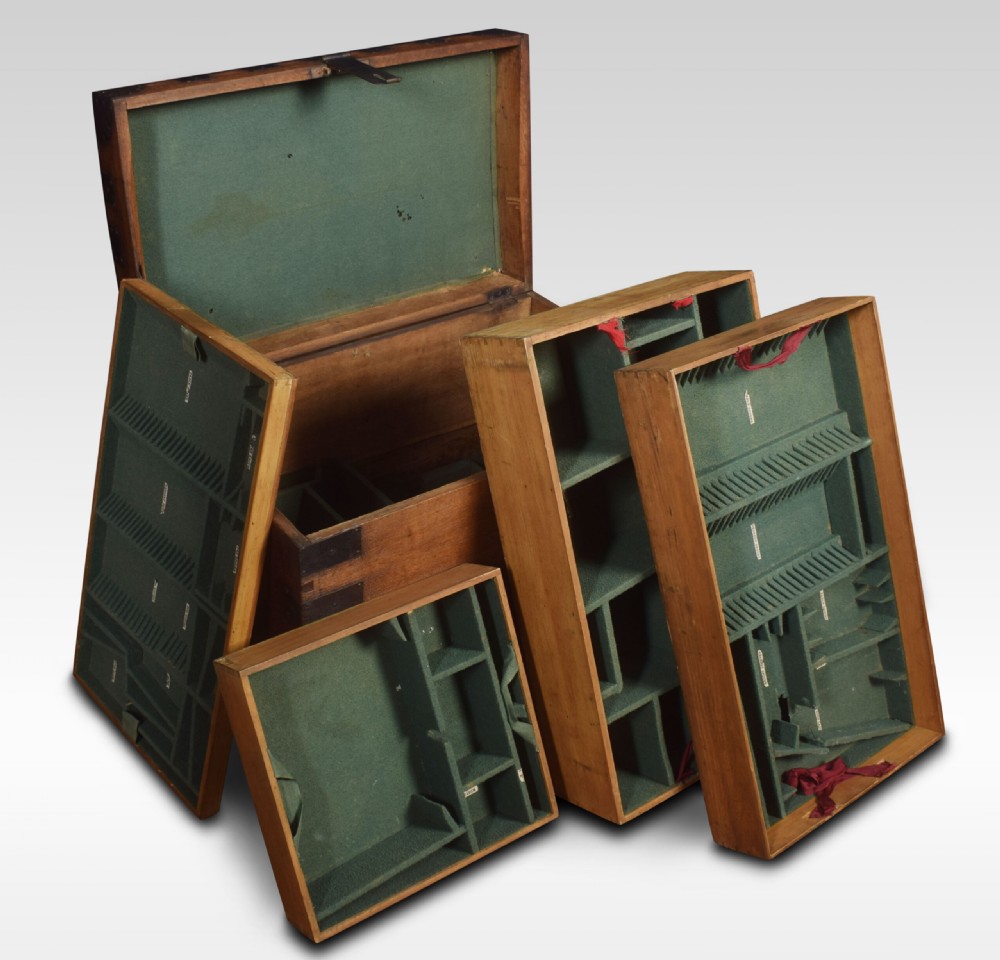 A 19th-century solid oak silver chest reinforced with dark iron straps, corner brackets, and a central latch. View III