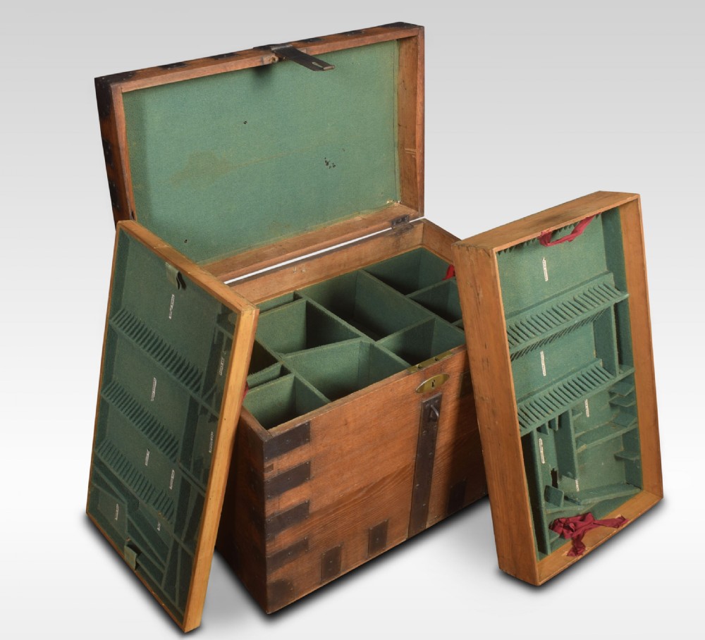 A 19th-century solid oak silver chest reinforced with dark iron straps, corner brackets, and a central latch. View V