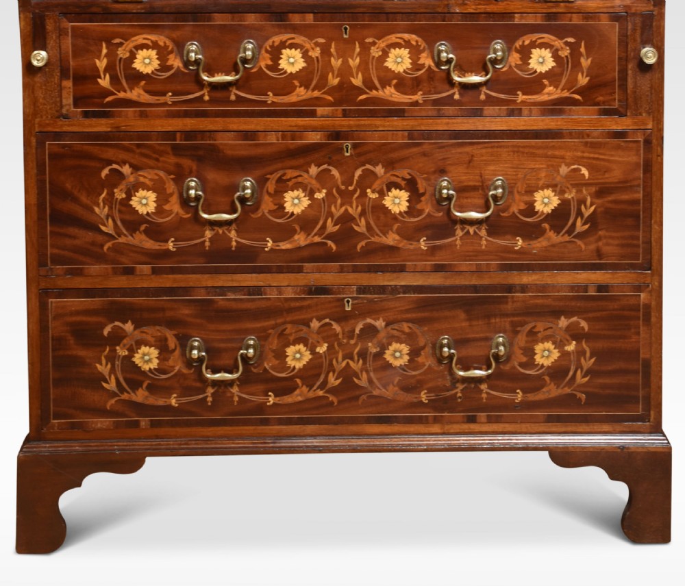 An antique mahogany bureau bookcase featuring a swan-neck pediment, glazed cabinet doors, a drop-down writing desk, and intricate floral marquetry inlay across the lower drawers. View IX