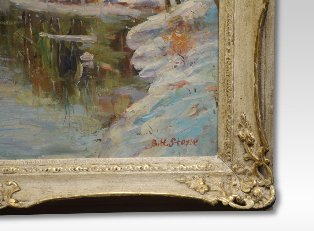An impressionist oil painting on canvas depicting a snowy river landscape set within a ornate swept cream and gilt frame, signed B. H. Stone. View II