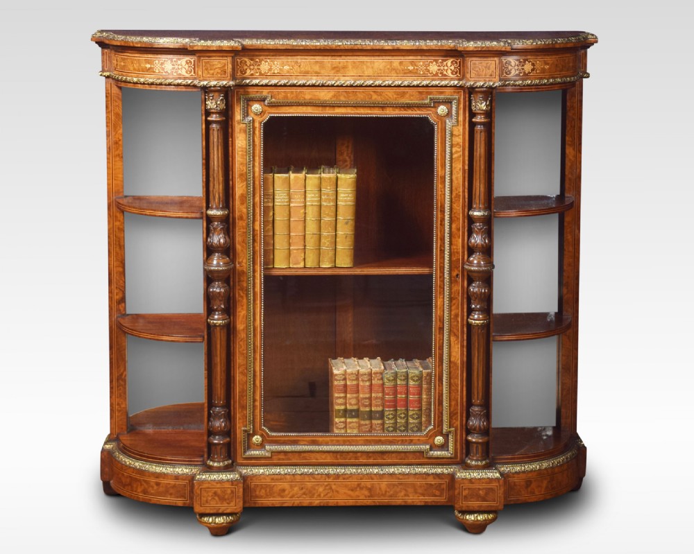 A nineteenth-century figured walnut credenza with a glazed central door, open mirrored side shelves, floral marquetry inlay, and gilt-bronze mounts. View III