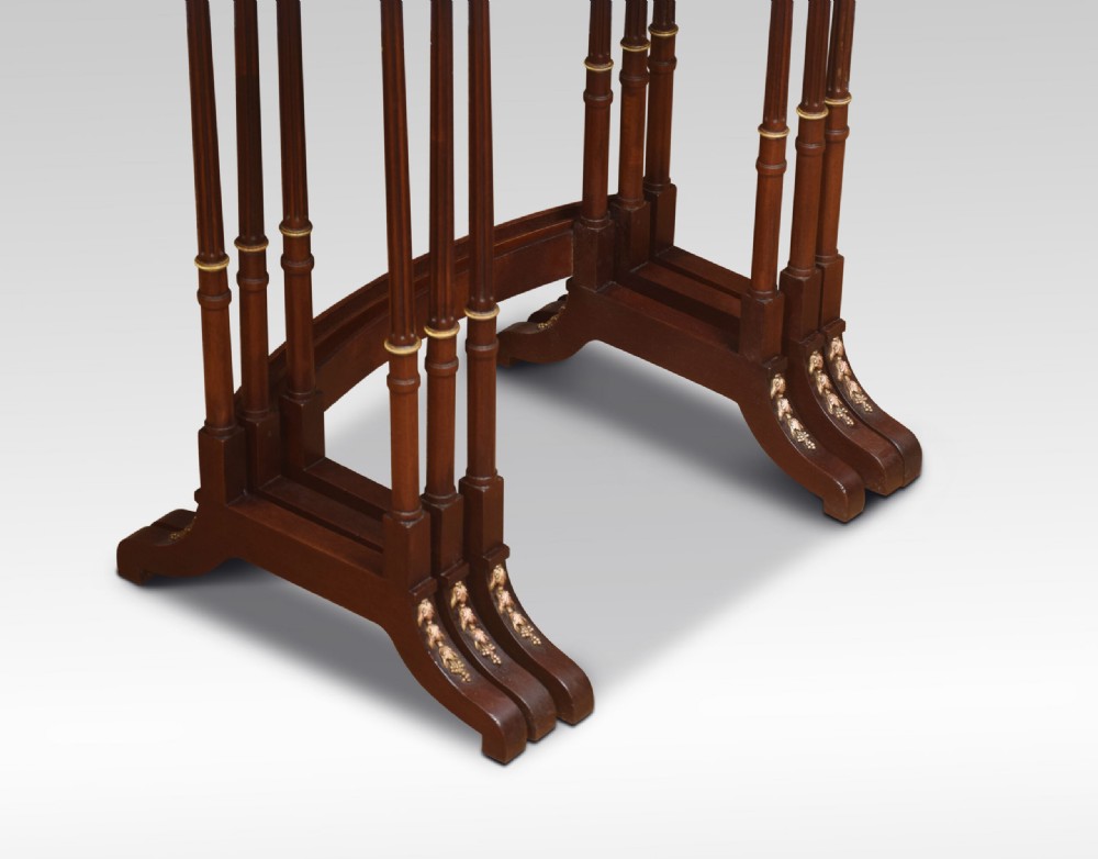 A set of three nesting walnut side tables featuring geometric parquetry tops, slender turned legs, and brass mounts. View II