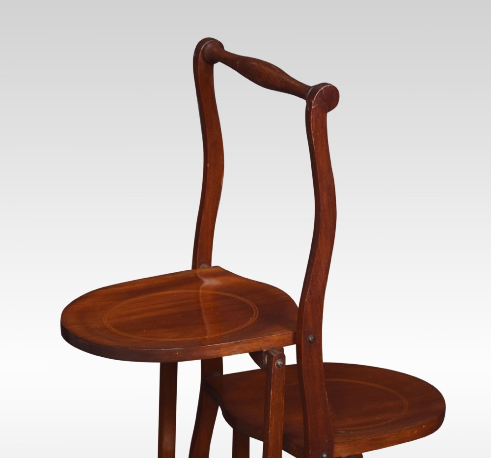 An antique four-tiered mahogany folding cake stand with circular inlaid trays and a turned top handle. View III