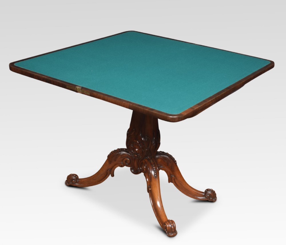 A Victorian dark rosewood fold-over card table featuring an ornate carved frieze, a central carved pedestal column, and carved scroll legs. View IX