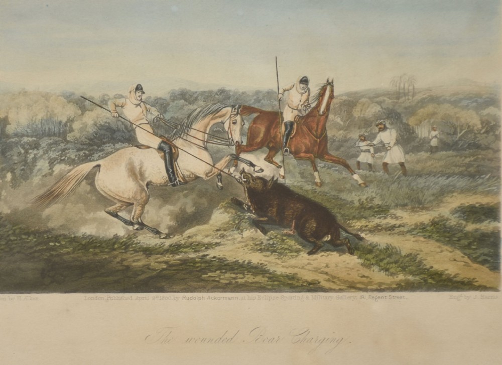 A set of four hand-coloured antique engravings depicting mounted riders engaging in boar hunting scenes in an Indian landscape. View II