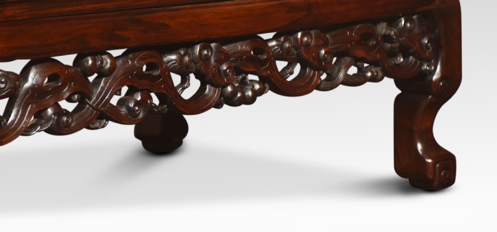 A pair of rectangular low Chinese hardwood coffee tables featuring detailed openwork carved aprons and short cabriole legs. View IV