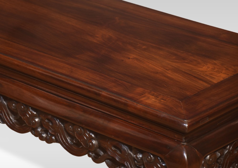 A pair of rectangular low Chinese hardwood coffee tables featuring detailed openwork carved aprons and short cabriole legs. View VII