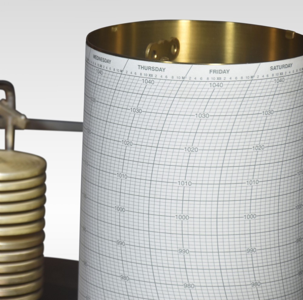An antique mahogany barograph with glass panels displaying an internal brass mechanism, aneroid capsules, and a paper chart drum. View II