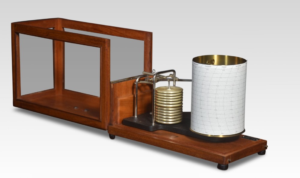 An antique mahogany barograph with glass panels displaying an internal brass mechanism, aneroid capsules, and a paper chart drum. View III