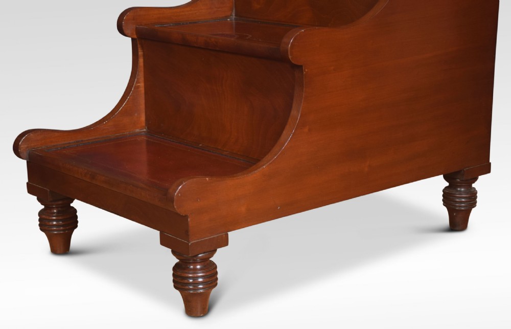 A 19th-century mahogany library step stool featuring three treads inlaid with gold-tooled leather and a top turned wooden handle. View VIII