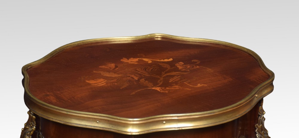 A French-style mahogany side table featuring floral marquetry inlay, gilt bronze mounts, slender cabriole legs, and an undertier. View II
