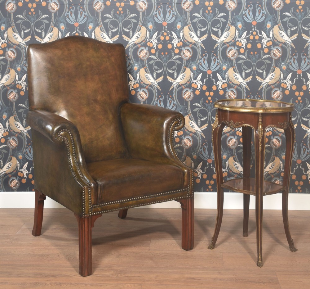 A French-style mahogany side table featuring floral marquetry inlay, gilt bronze mounts, slender cabriole legs, and an undertier. View IX