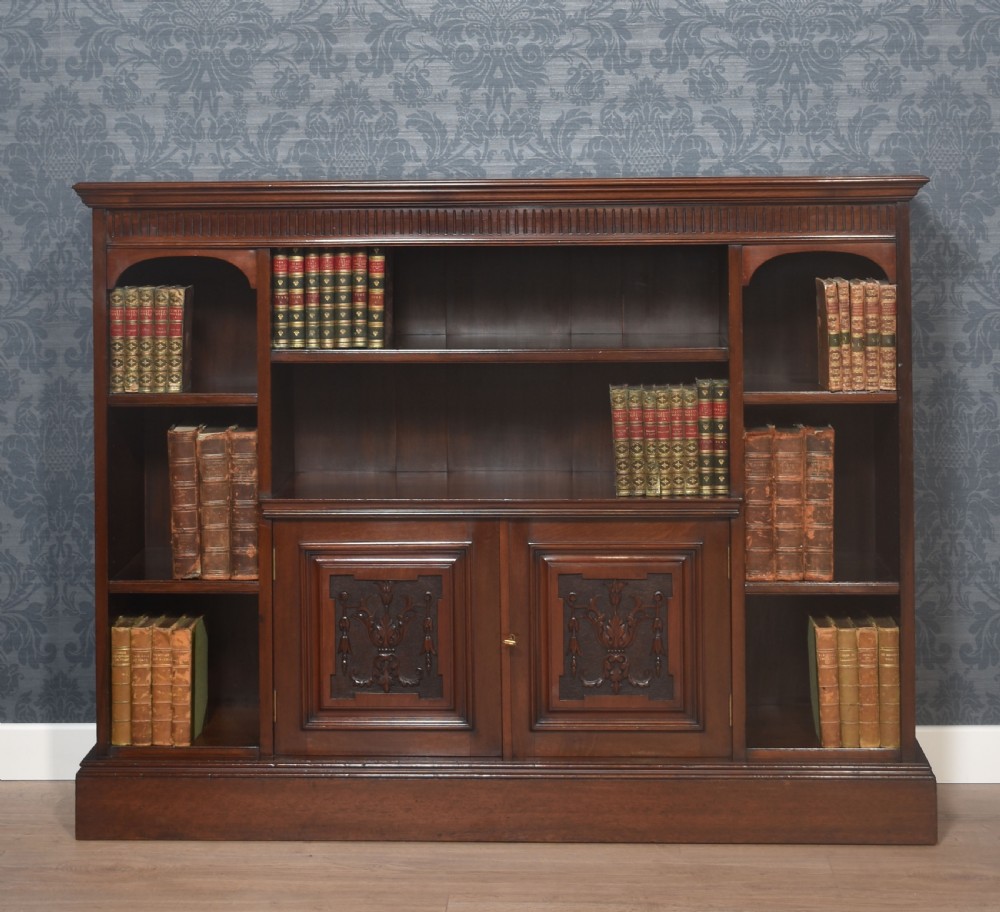 Carved walnut open bookcase