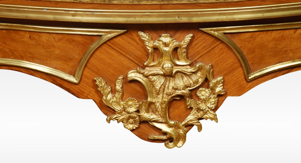 A French Louis XV style walnut centre table featuring cabriole legs, ornate gilt bronze mounts, and an ebonised top decorated with musical instrument marquetry. View VIII
