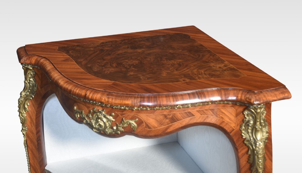 A French Louis XV style kingwood open corner cabinet featuring gilt bronze ormolu mounts, serpentine edges, and three cream fabric-lined shelves. View IX