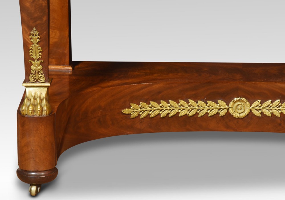 A 19th-century French Empire mahogany dressing table with an oval swivelling mirror, gilded bronze ormolu mounts, swan neck supports, and lion head handles. View XI
