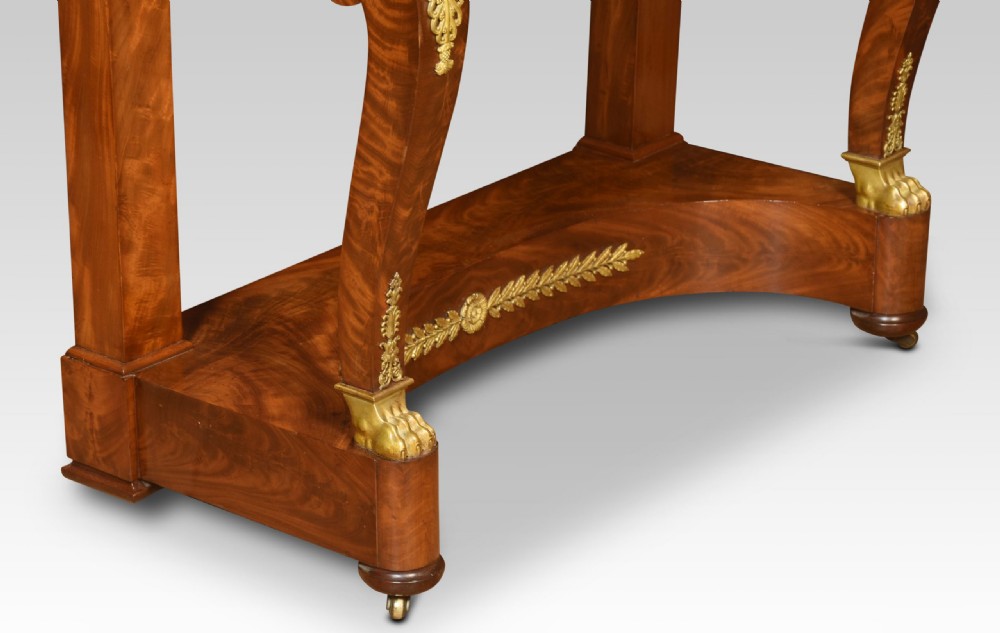 A 19th-century French Empire mahogany dressing table with an oval swivelling mirror, gilded bronze ormolu mounts, swan neck supports, and lion head handles. View XIV