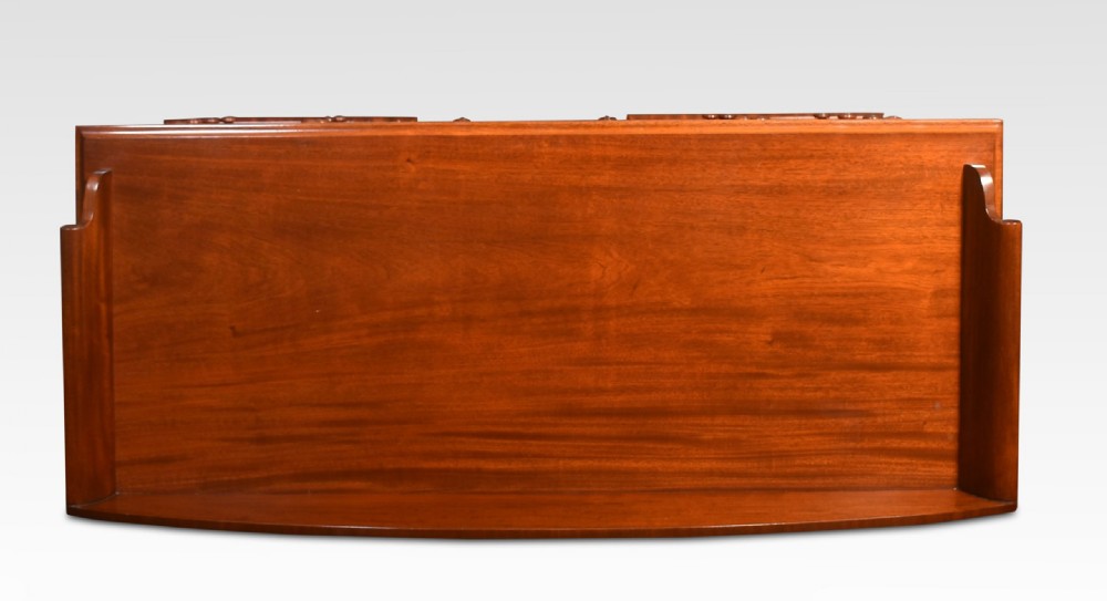 A nineteenth-century mahogany kneehole dressing table featuring an arched gallery upstand, nine drawers with turned handles, and a central cupboard door. View X