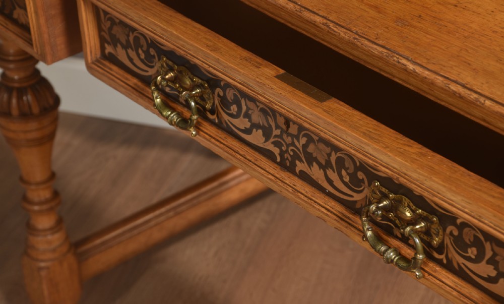 An oak dressing table featuring marquetry inlay patterns on the drawers and side cabinets, a central rectangular mirror, turned legs, and an H-stretcher. View XV