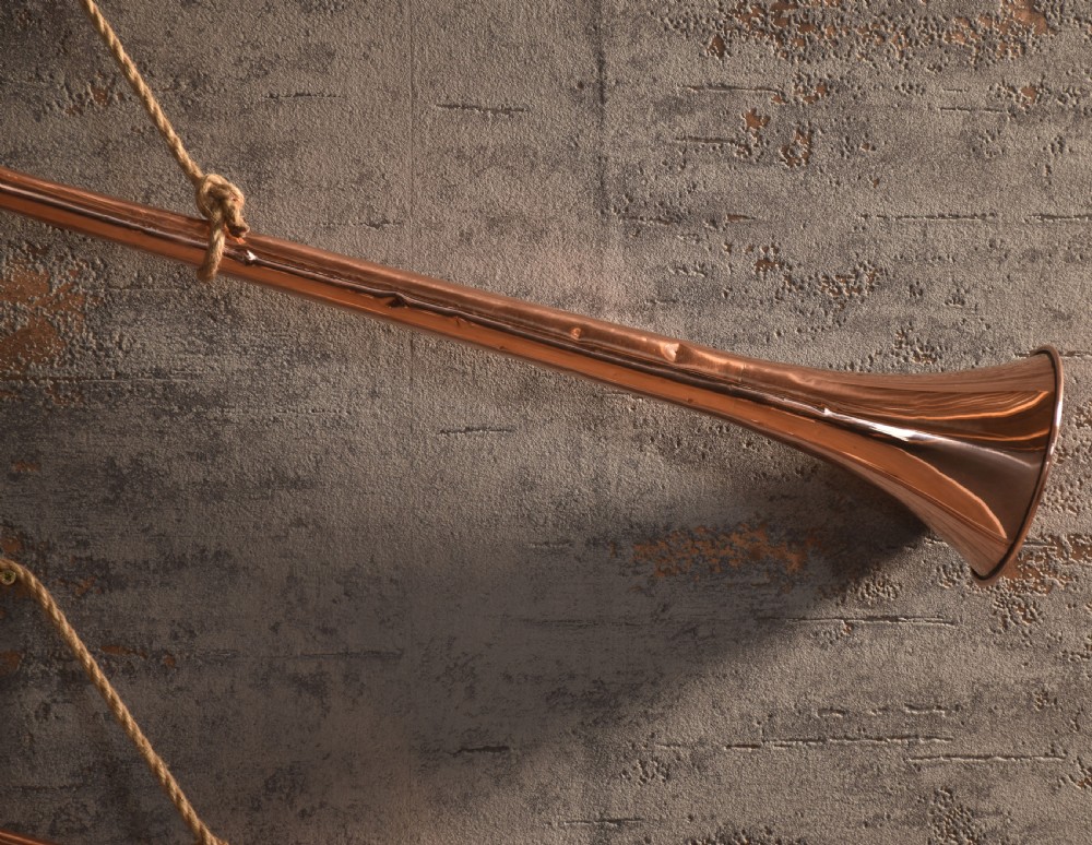 A set of two straight copper coaching horns with brass mouthpieces and flared bells, each rigged with a suspension rope. View II