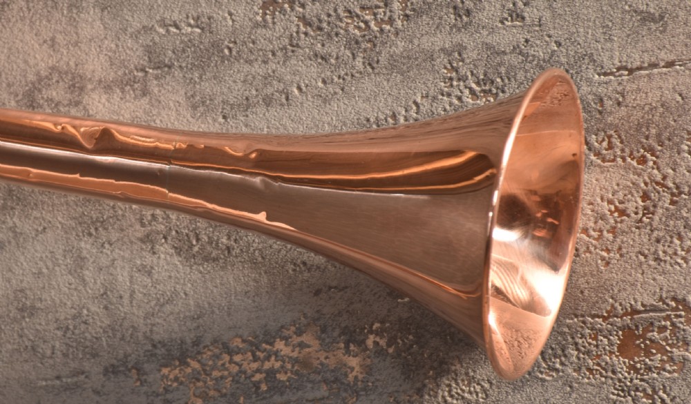 A set of two straight copper coaching horns with brass mouthpieces and flared bells, each rigged with a suspension rope. View III