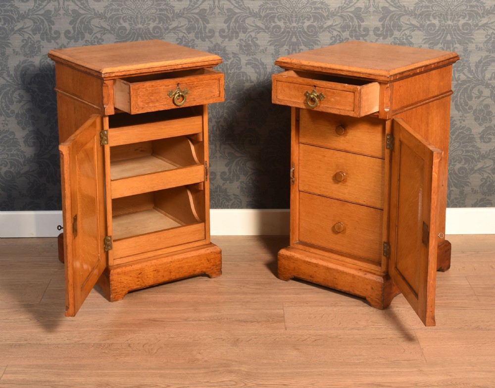A matching pair of golden oak bedside cabinets featuring single top drawers with brass ring pulls and lower cupboard doors with diagonal plank detailing. View VII