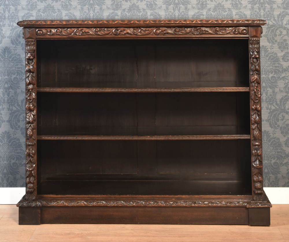 Carved oak open bookcase