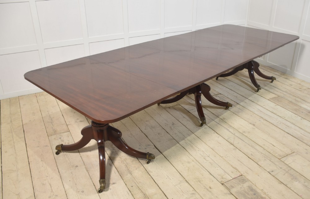 Regency mahogany triple pillar dining table