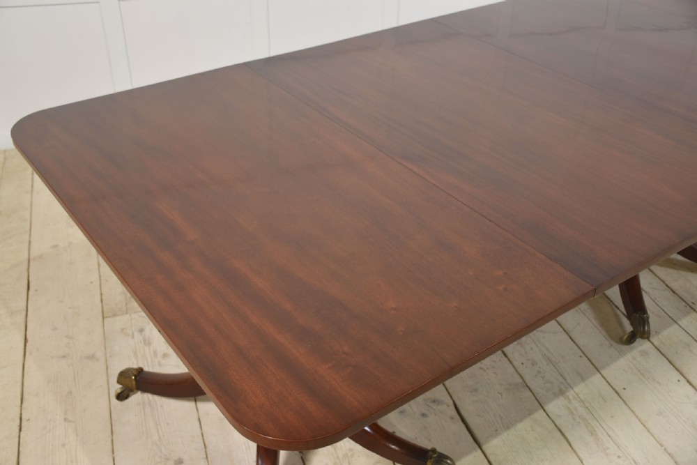 Regency mahogany triple pillar dining table View IX