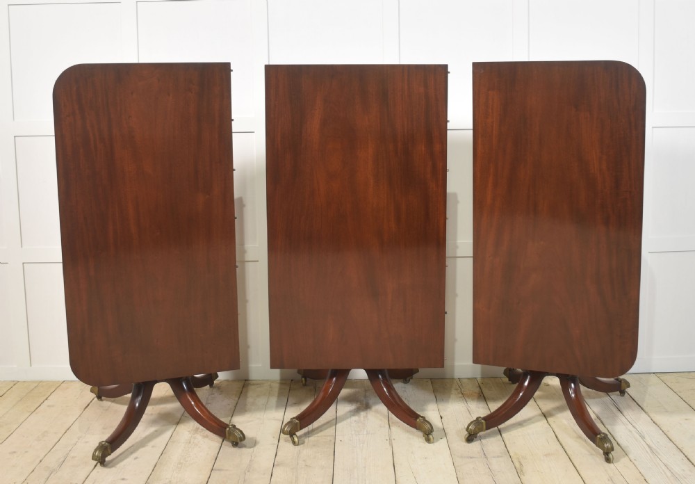 Regency mahogany triple pillar dining table View XII