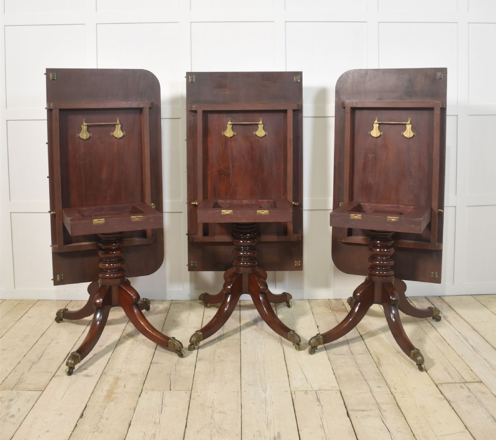 Regency mahogany triple pillar dining table View XV