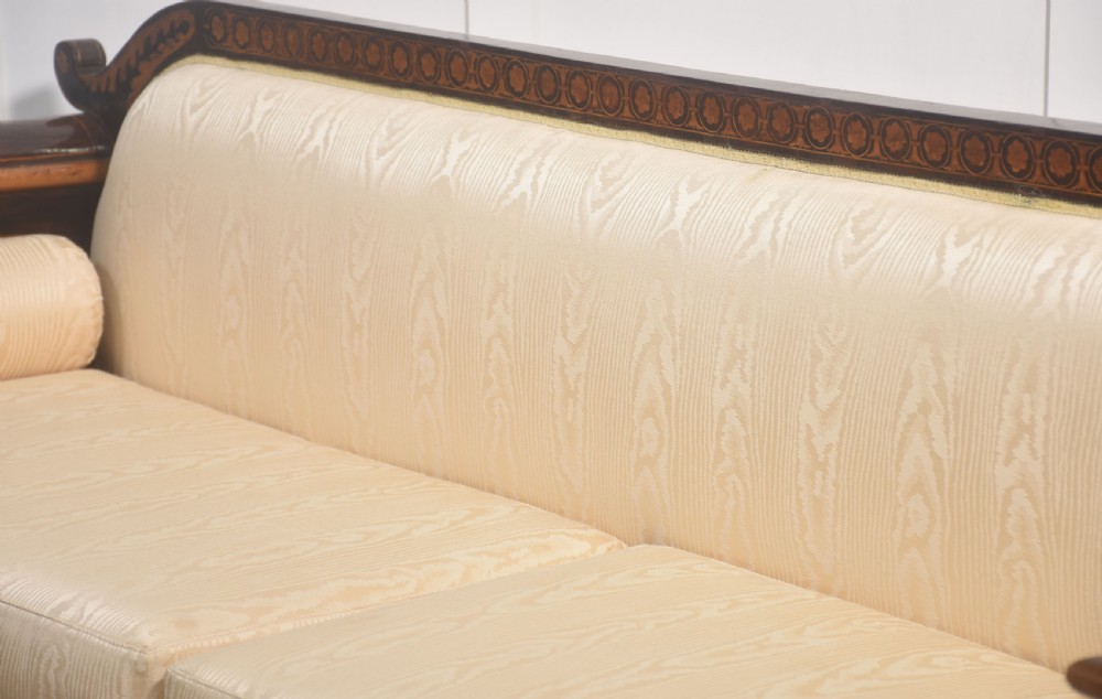 A Dutch marquetry settee with dark wood floral inlay along the frame and light cream upholstered cushions. View XI