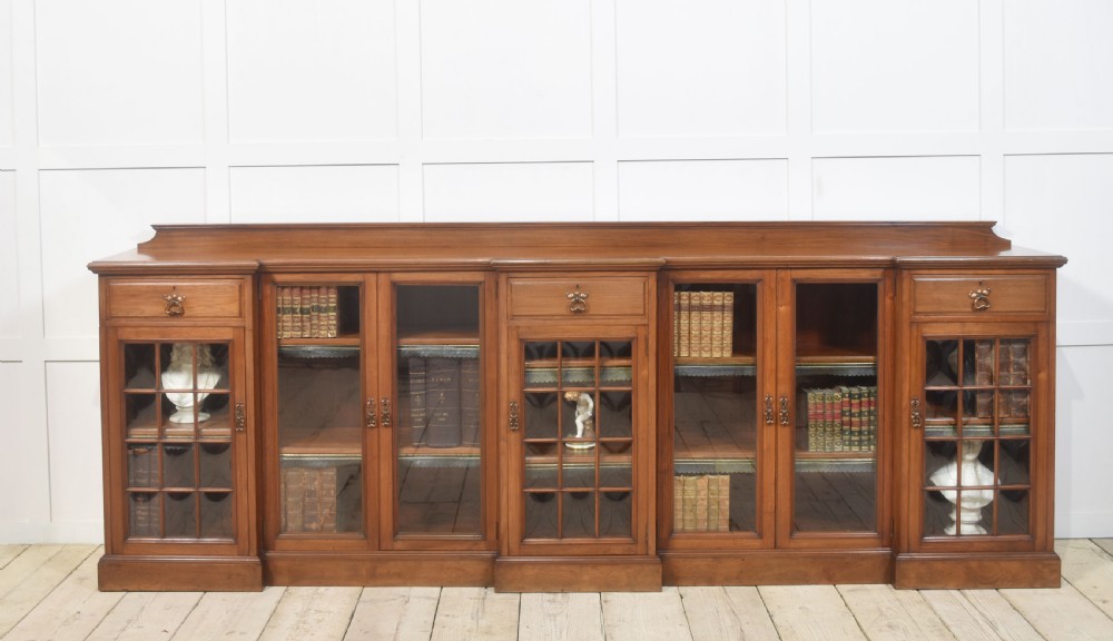 Large walnut breakfront low bookcase