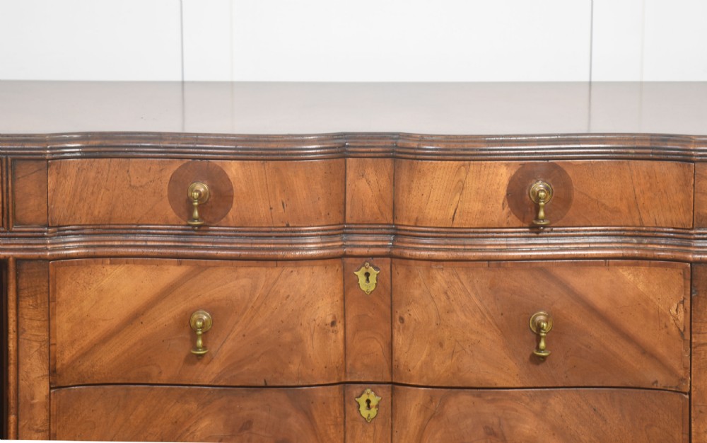 A wide walnut crossbanded Queen Anne style sideboard featuring multiple drawers, cupboard doors, drop brass handles, and carved cabriole legs. View XIV