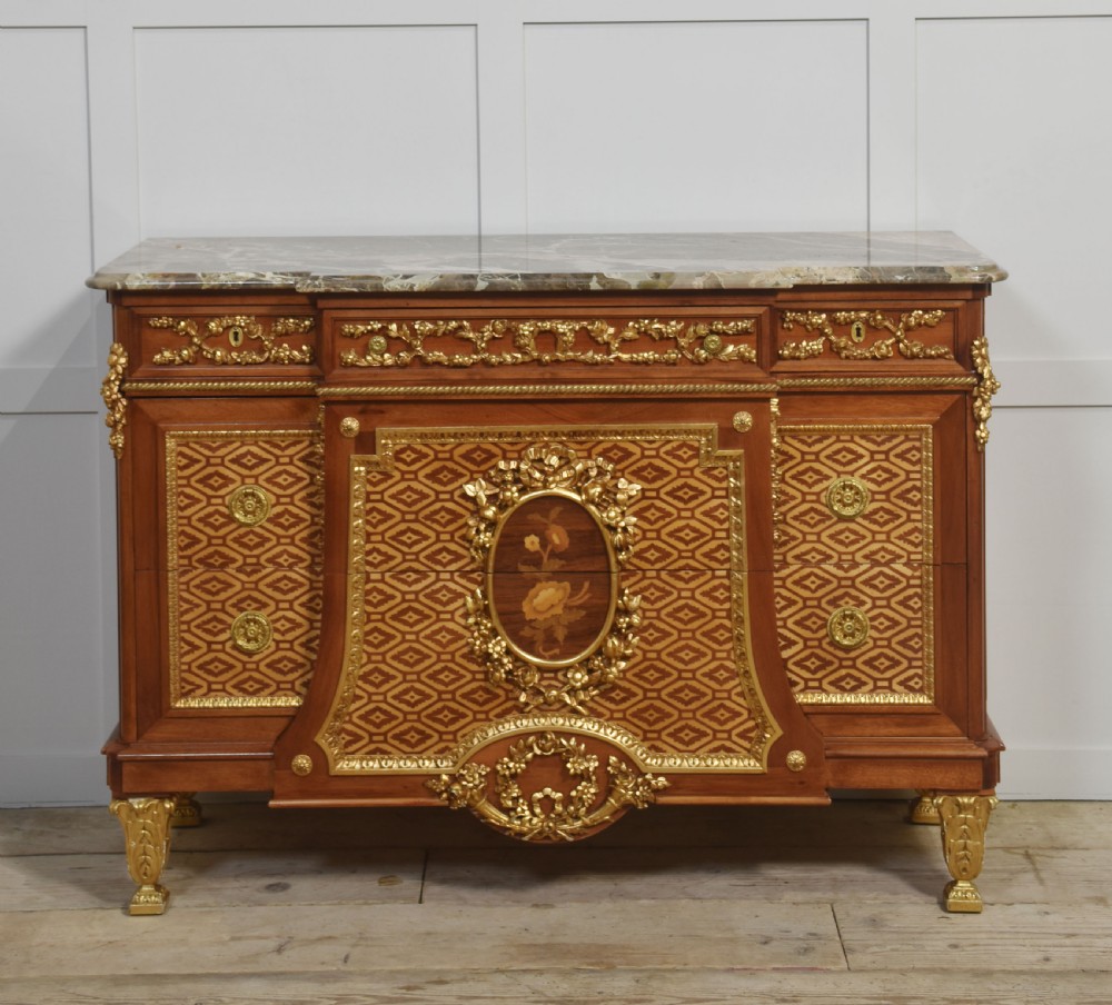 Italian inlaid and parcel gilt mahogany breakfront commode